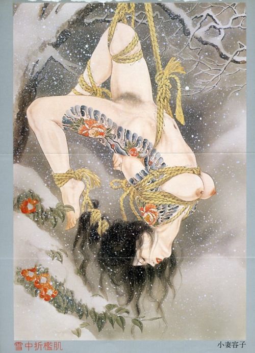 Tattooed girl tied to a snowy tree hanging upside down by Ozuma Kaname