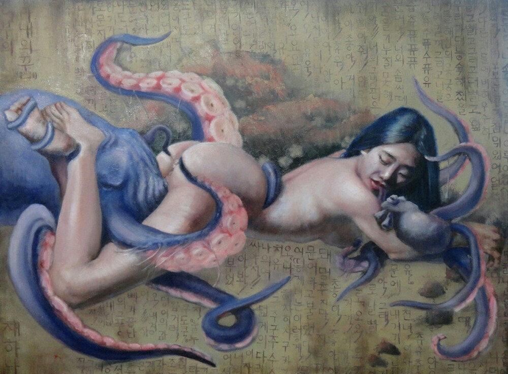 nude Asian girl laying on her belly with blue octopus performing cunnilingus