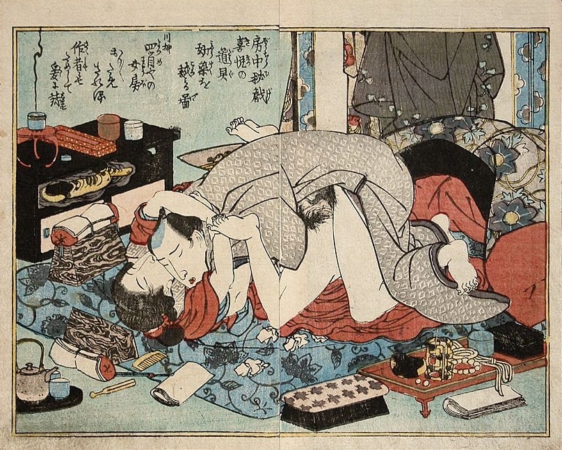 A shunga print displaying a couple making passionate love while being surrounded by all sorts of sex toys