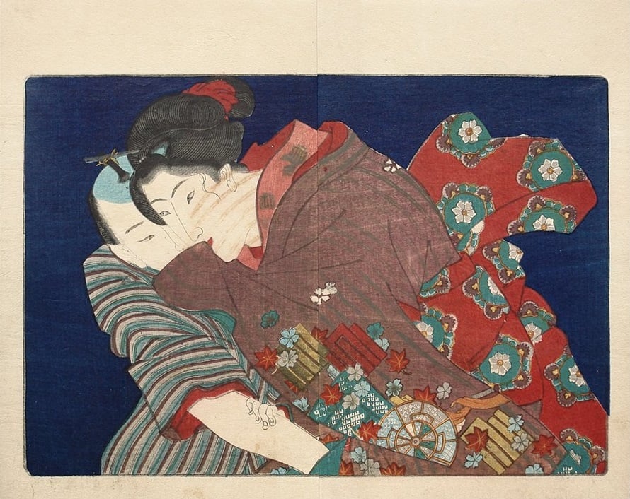 A man puts his hand into a woman's kimono’s opening. She is trying to stop him but smiles and covers her mouth.