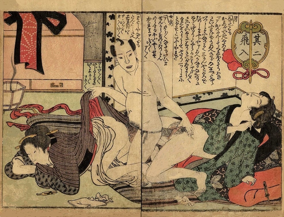 A male lover pleasing two women at the same time using a harigata.