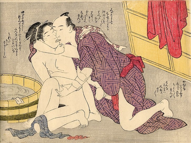 A kissing couple is getting ready to make love after bathing,