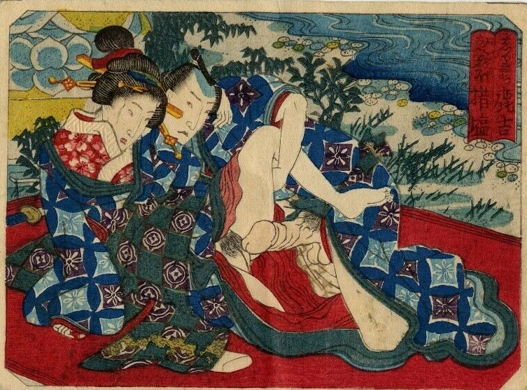 At the riverbank on a red blanket. He is a samurai as the handle of the sword in the back indicates. by Utagawa school 