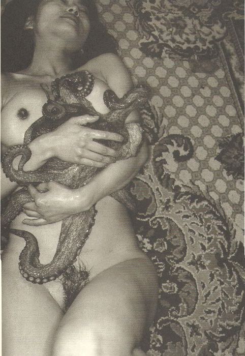 photograph with a modern variation of the dream of the fisherman's wife nude female embracing octopus by Hajime Satawari 