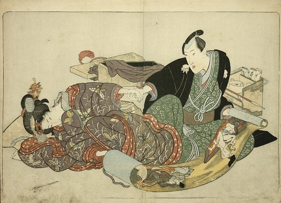 Newly-wed couple examining an old shunga scroll